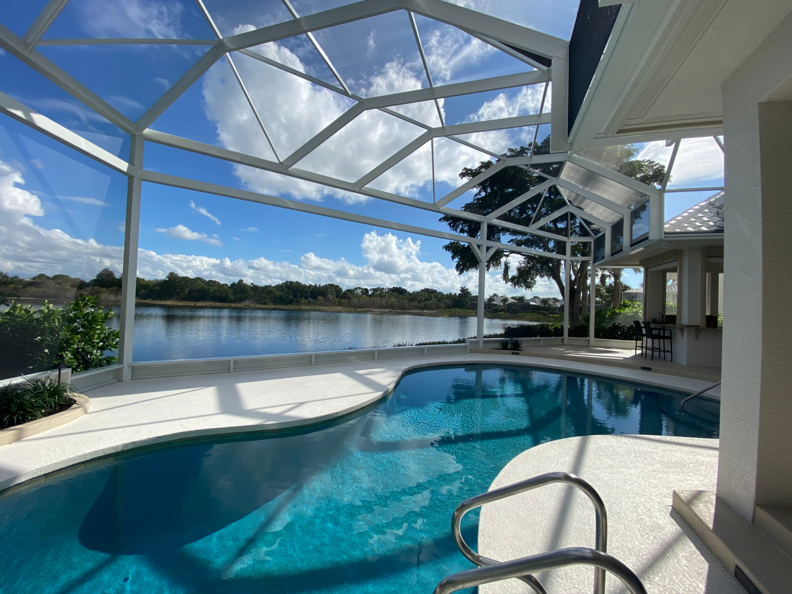 interior of a picture view screen enclosure around a pool